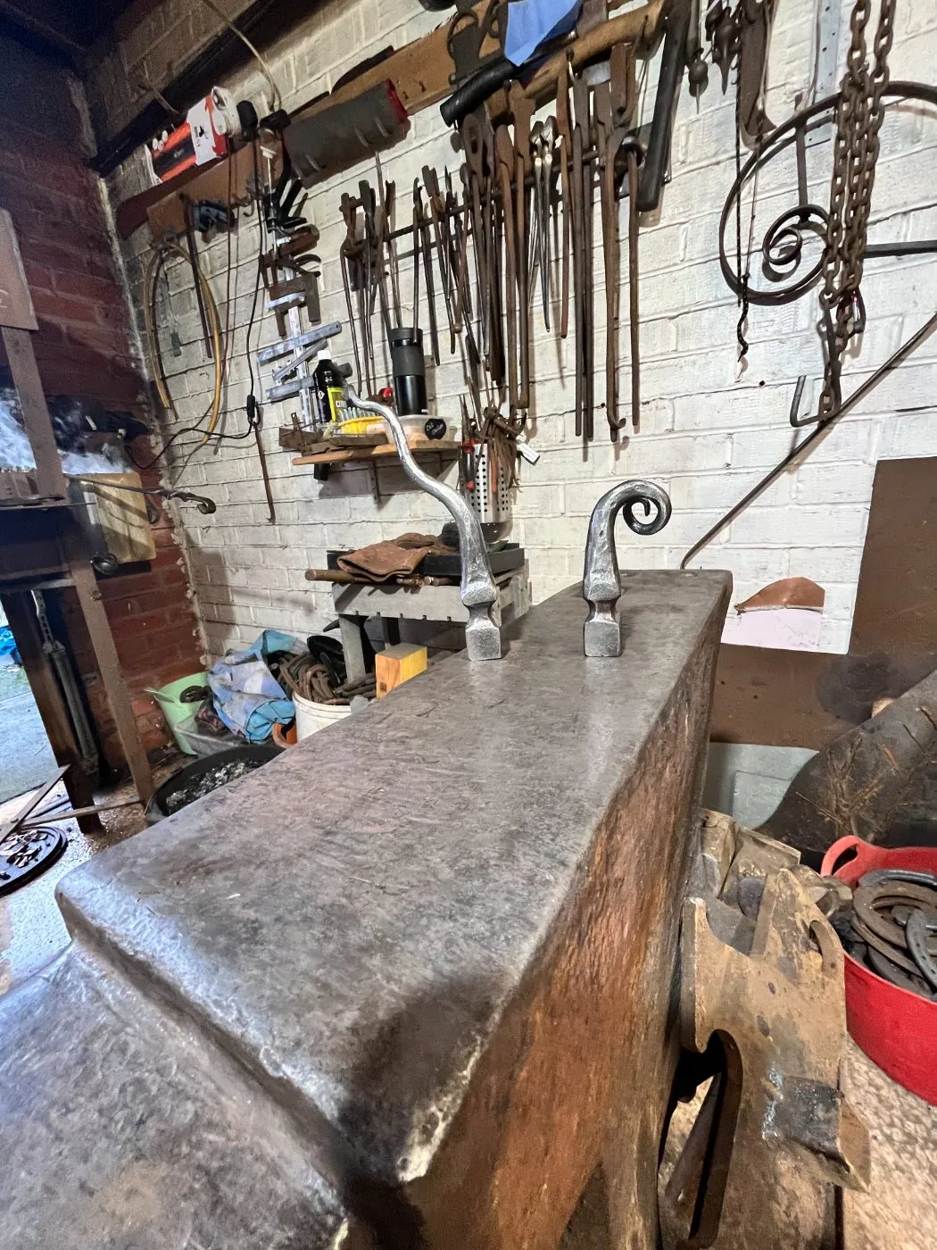 Geordi the forge: the anvil, with forged finials lined up along it