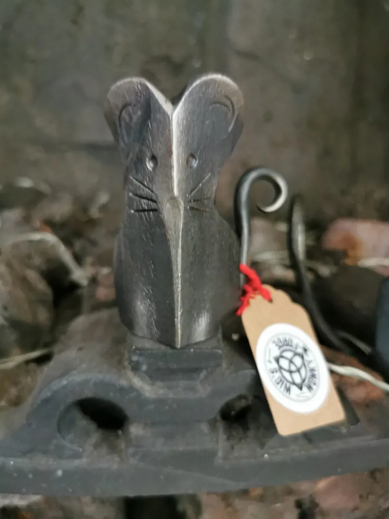 A forged mouse with a Wig's Wonky Forge kraft tag